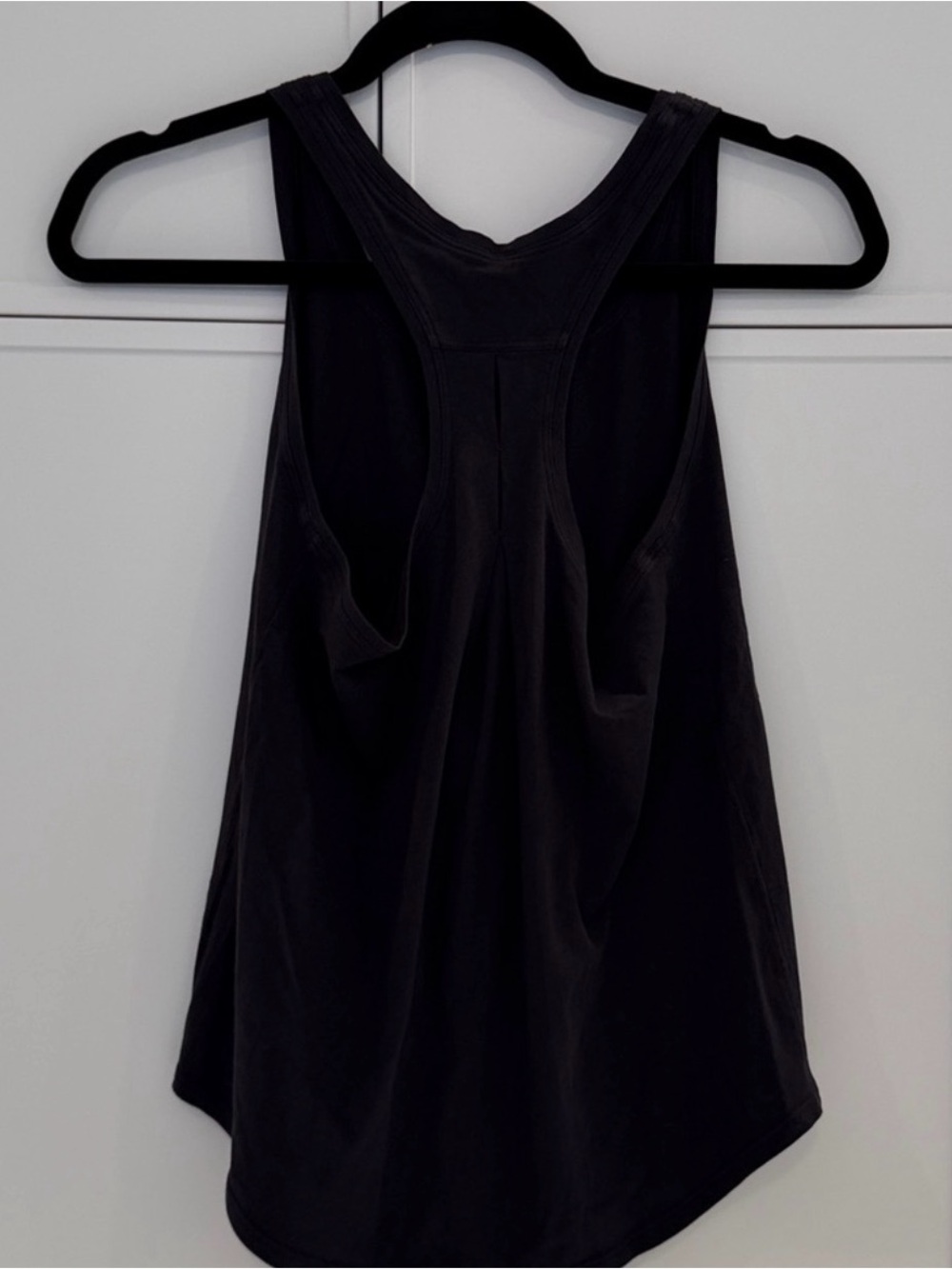 Lululemon black size 4 sleeveless tank for women. Great condition. Loose fit.